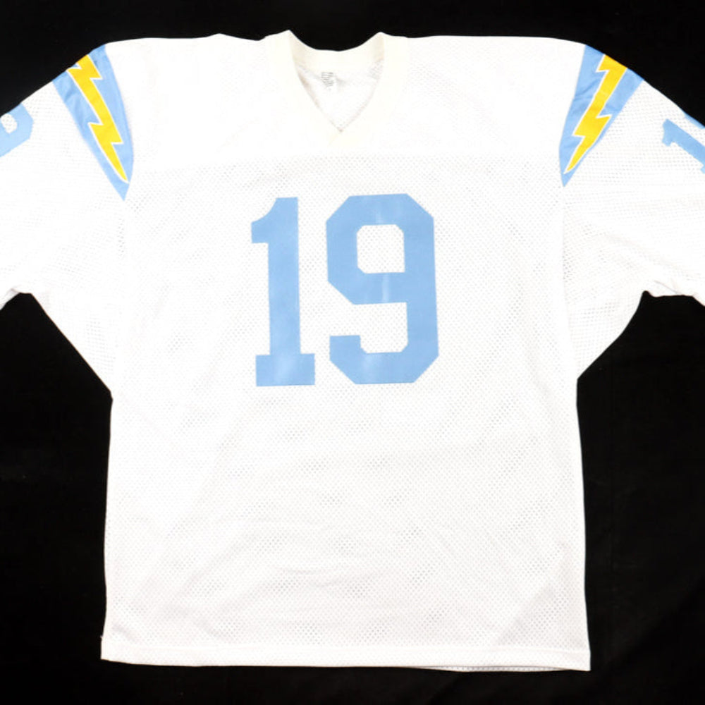 White sports jersey with blue number 19 and lightning bolt designs on a black background
