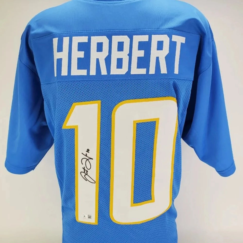 Justin Herbert Signed Blue Jersey (Beckett Witness COA)