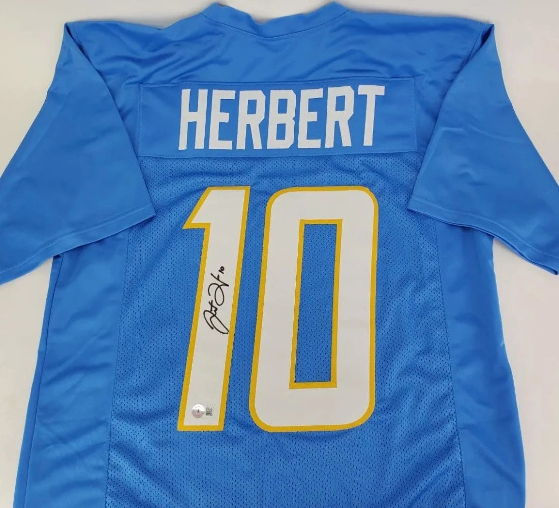 Justin Herbert Signed Blue Jersey (Beckett Witness COA)